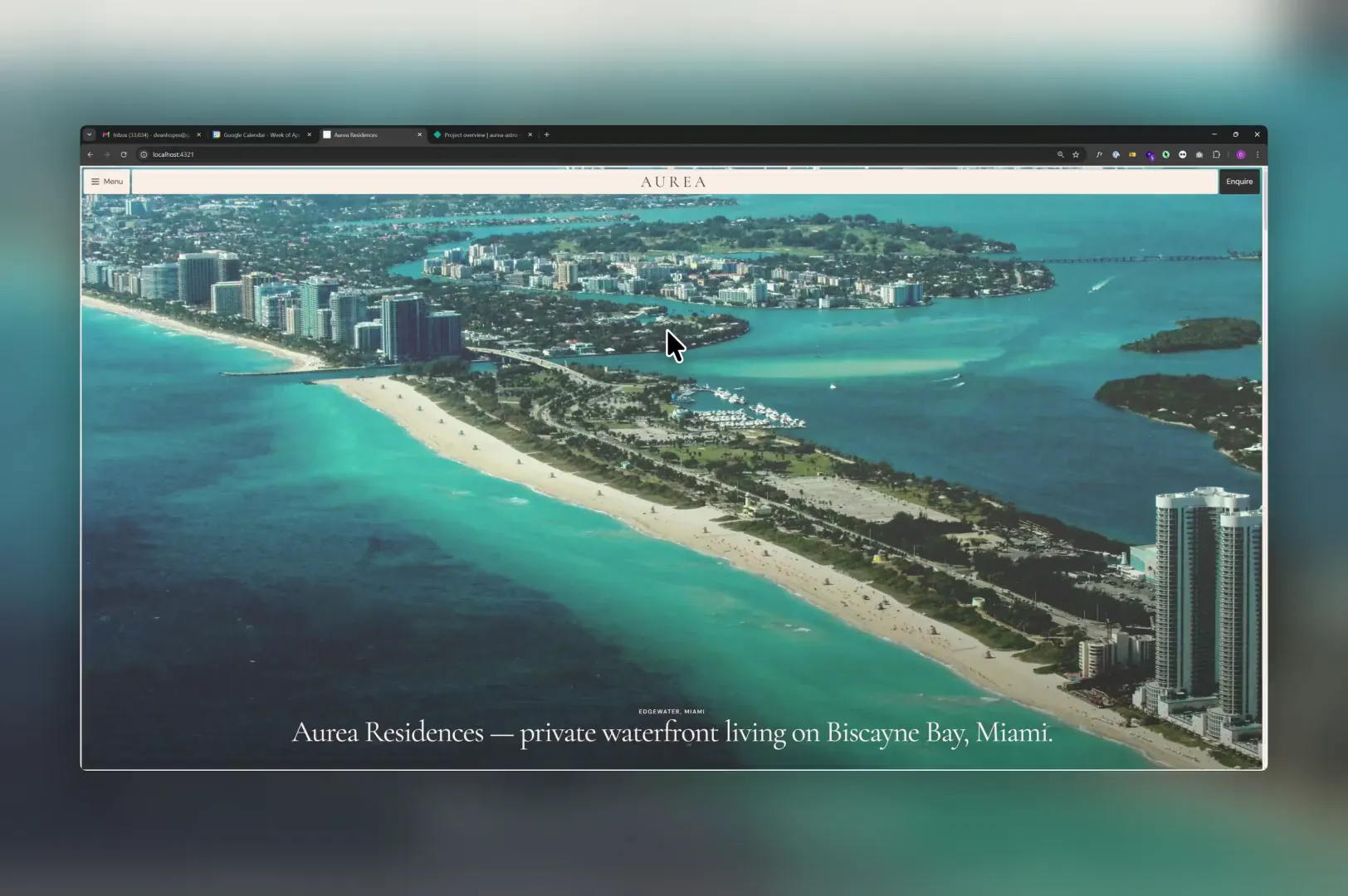 Waterfront property website with an aerial Miami coastline photograph, cream navigation and large serif typography.
